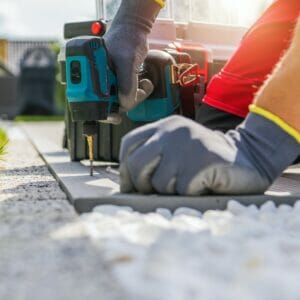 Professional Contractor Worker Building Composite Outdoor Patio Deck
